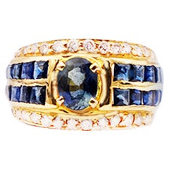 Vintage Oval Sapphire with Princess Channel and Diamond 18 Karat Band Ring