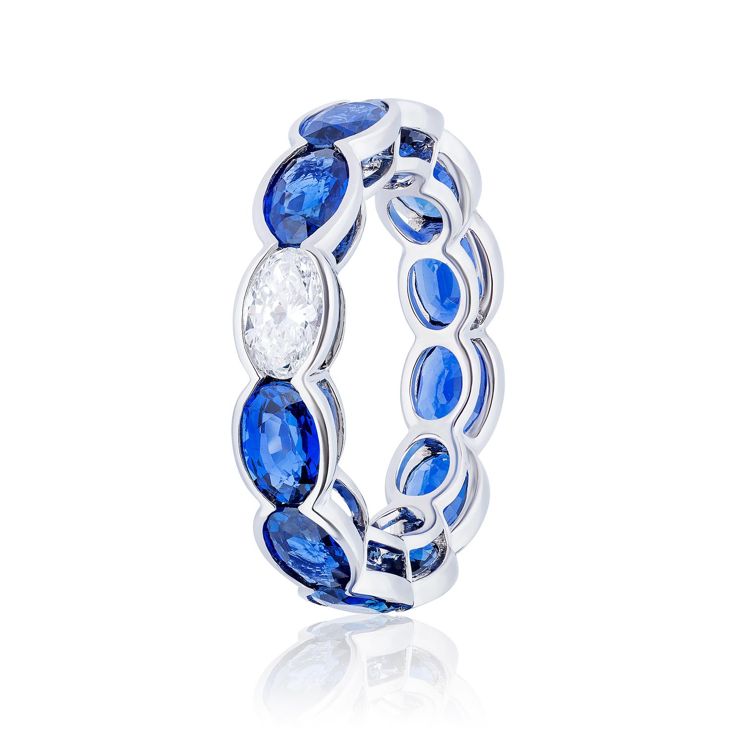 Semi Bezel Set Oval Gemstones

11 Sapphires weighing 6.86 Carats
1 Oval Diamond weighing 0.41 Carats
Set in Platinum.

Also available in Emeralds and Rubies.