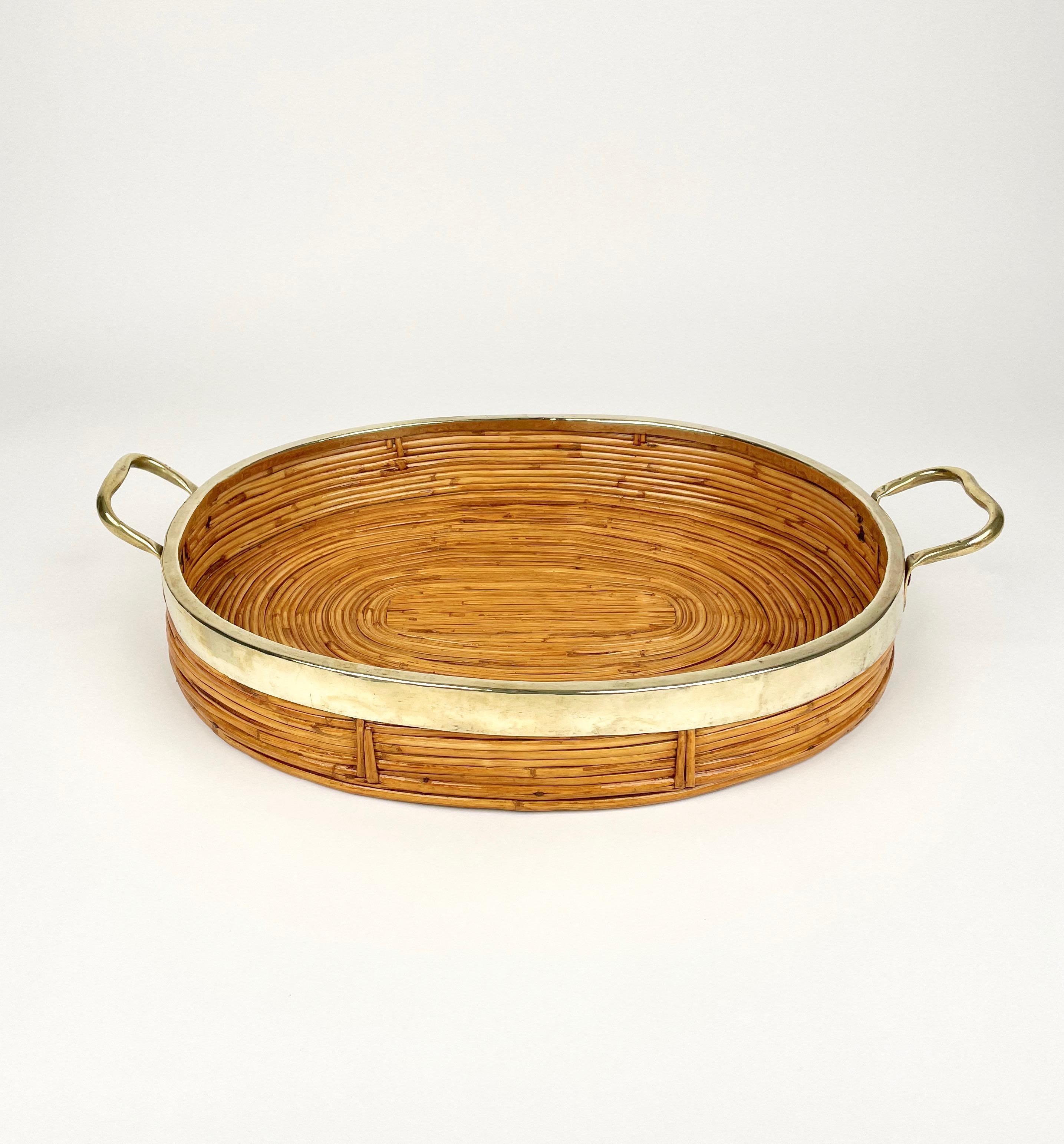 Beautiful 1970s Italian Mid-Century Modern serving cocktail bar tray with polished brass handles. Made of rattan and bamboo, this charming piece is in the typical style where the organic beauty of the woven materials is timeless and classic, making