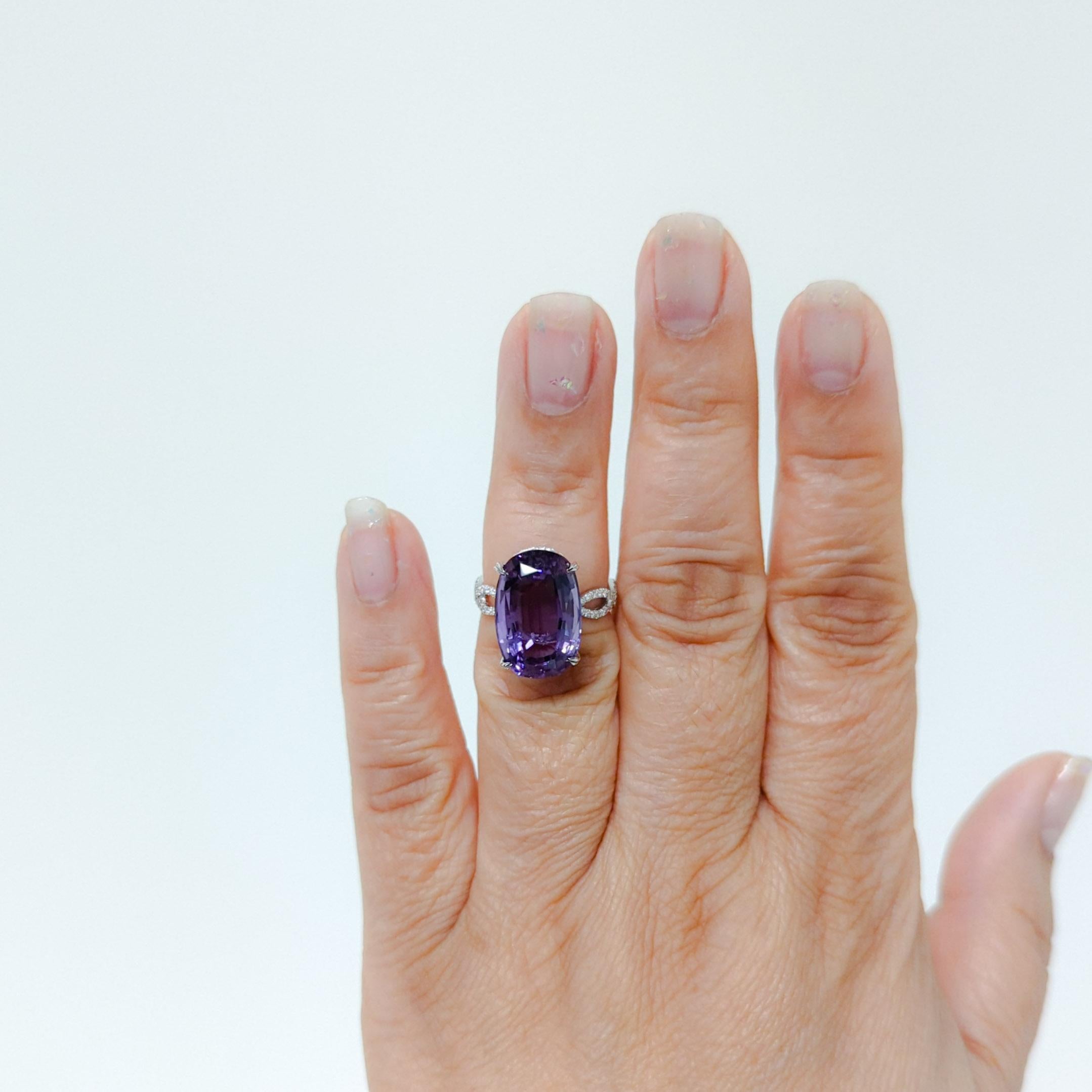 Gorgeous 10.20 ct. amethyst oval with 0.33 ct. good quality white diamond rounds.  Handmade in 18k white gold.  The braided band is so pretty and delicate.  Ring size 5.75.  Can be resized up or down one to two sizes only because of the braided
