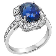 Oval Shape Blue Sapphire & Baguette White Diamond 18K White Gold Halo Ring