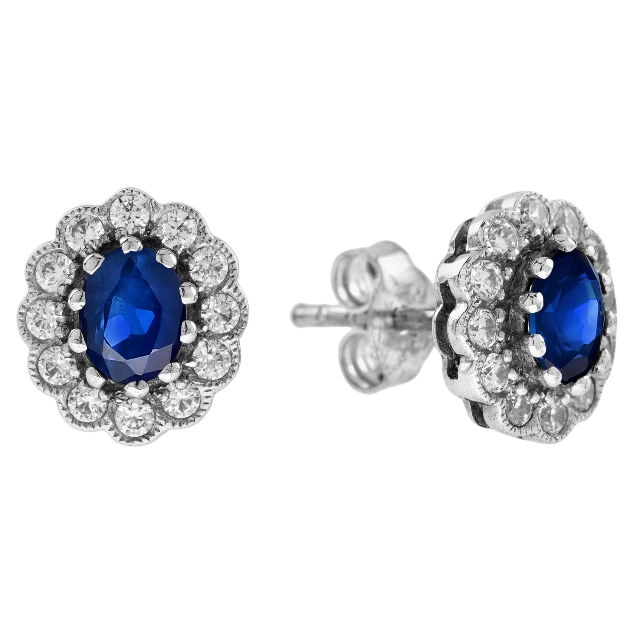 Boucles d'oreilles en or blanc de forme ovale saphir bleu et diamant style antique floral