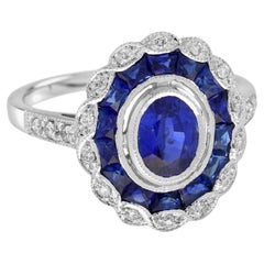 Zafiro azul ovalado y diamante Anillo de oro blanco con halo estilo art déco vintage