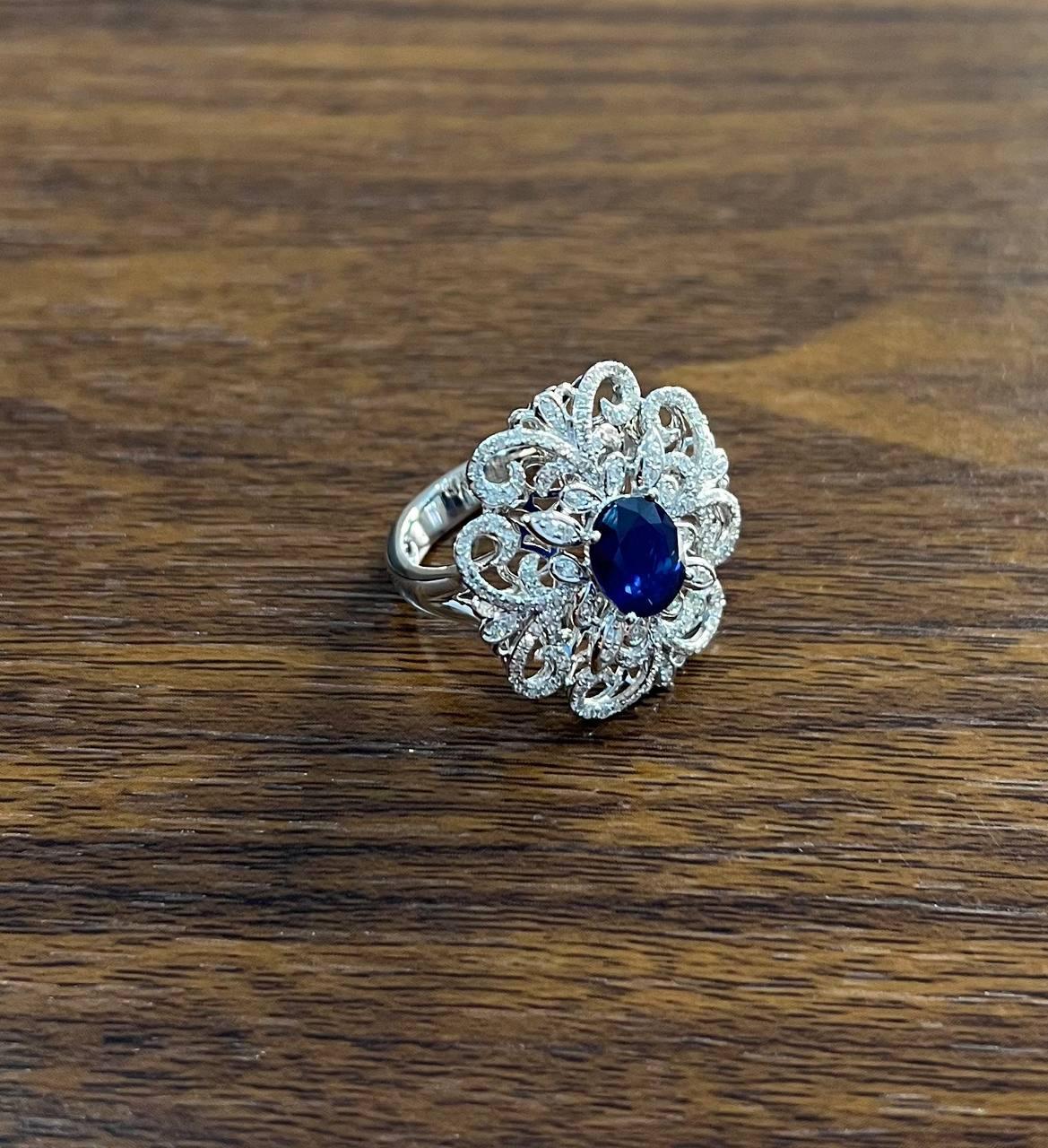 Oval Shape Blue Sapphire Diamonds Halo Pave Set White Gold Statement Motif Ring For Sale 1