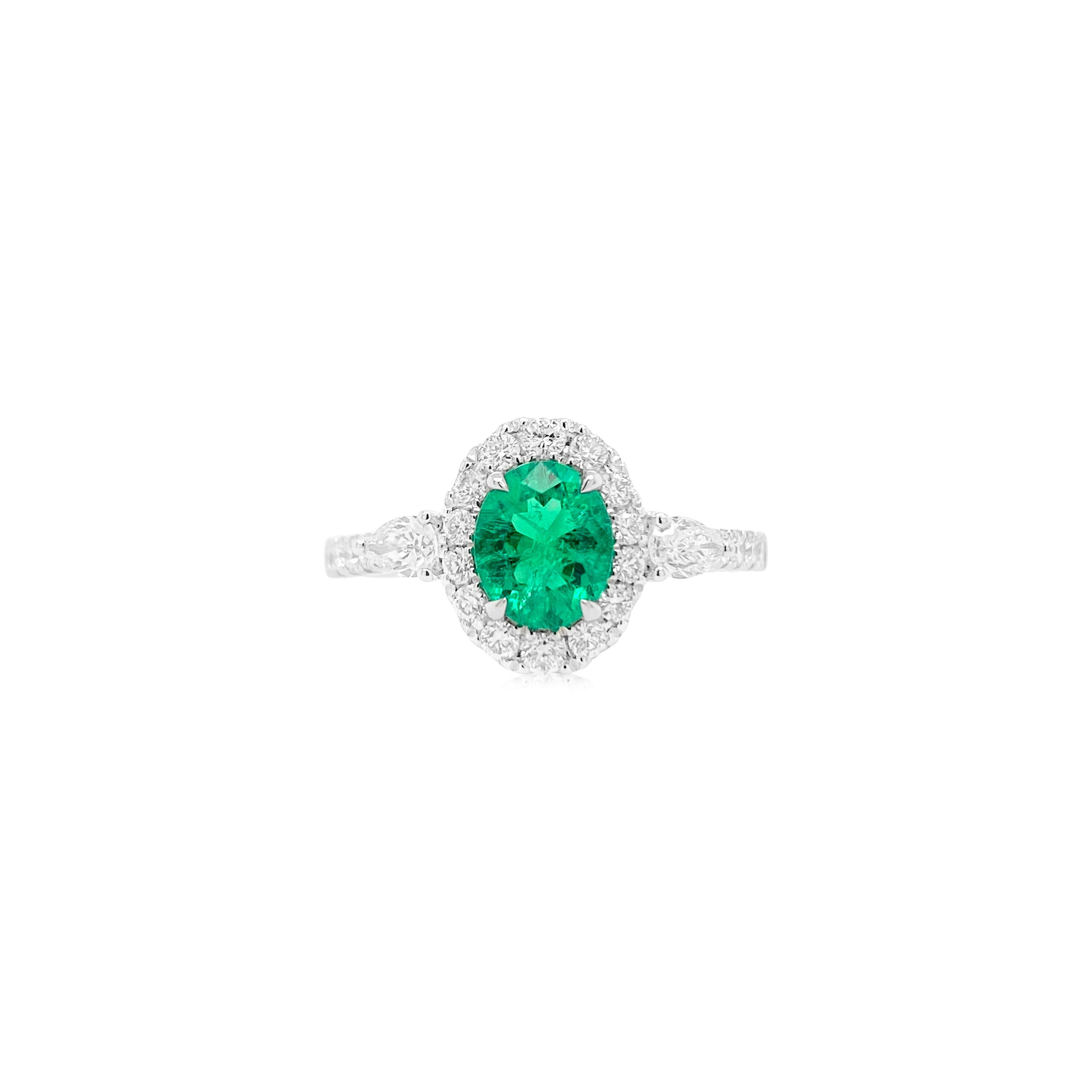 Elevate your style with our exquisite Oval Shape Natural Colombian Emerald Ring, adorned with stunning Pear Shape White Diamonds. This captivating piece seamlessly blends elegance and nature's beauty, making it a timeless symbol of sophistication.
