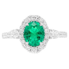 Oval Shape Colombian Emerald Ring with Pear shape white Diamonds