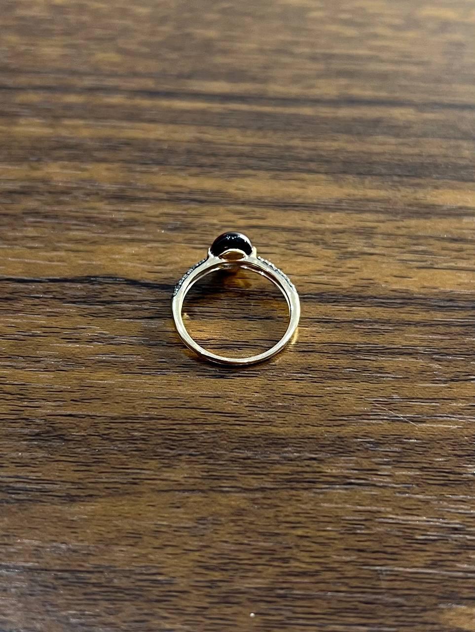 Women's Oval Shape Dark Red Ruby Cabochon 14K Yellow Gold Diamond Accented Cocktail Ring For Sale