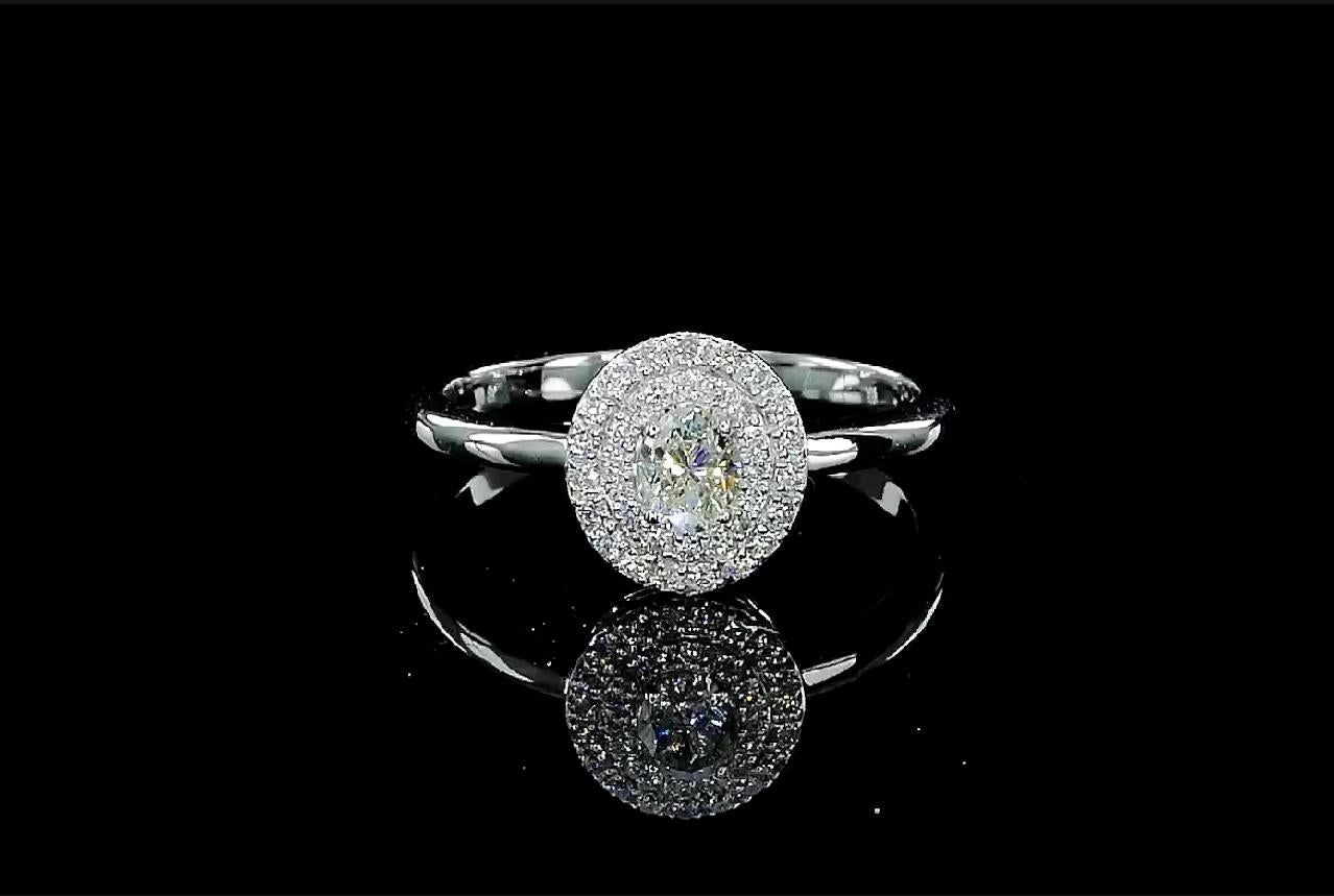 18kt white gold ring with diamonds
  
  Gold colour & karat: White gold 18kt
  Weight: 2.68 grams
  
  Set with-
  Stone type: Diamonds
  Shape: Oval
  Carat: 0.26
  Colour: F
  Clarity: -
  
  Surrounding Stones: Diamonds
 1) Side White Diamonds
 