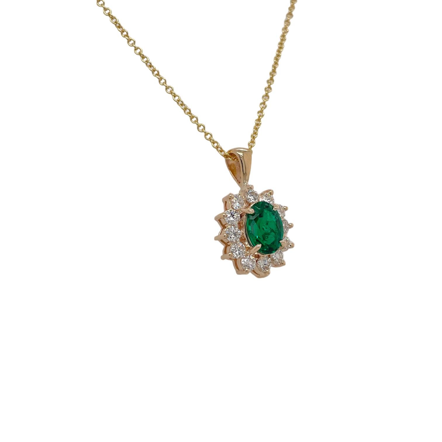 Pendant features 1 center oval brilliant shape emerald weighing 1.27ct. Oval emerald is surrounded by 12 round brilliant diamonds, Princess Diana style halo, weighing 0.65tcw. Emerald originates from Zambia. Diamonds are near colorless and SI1 in