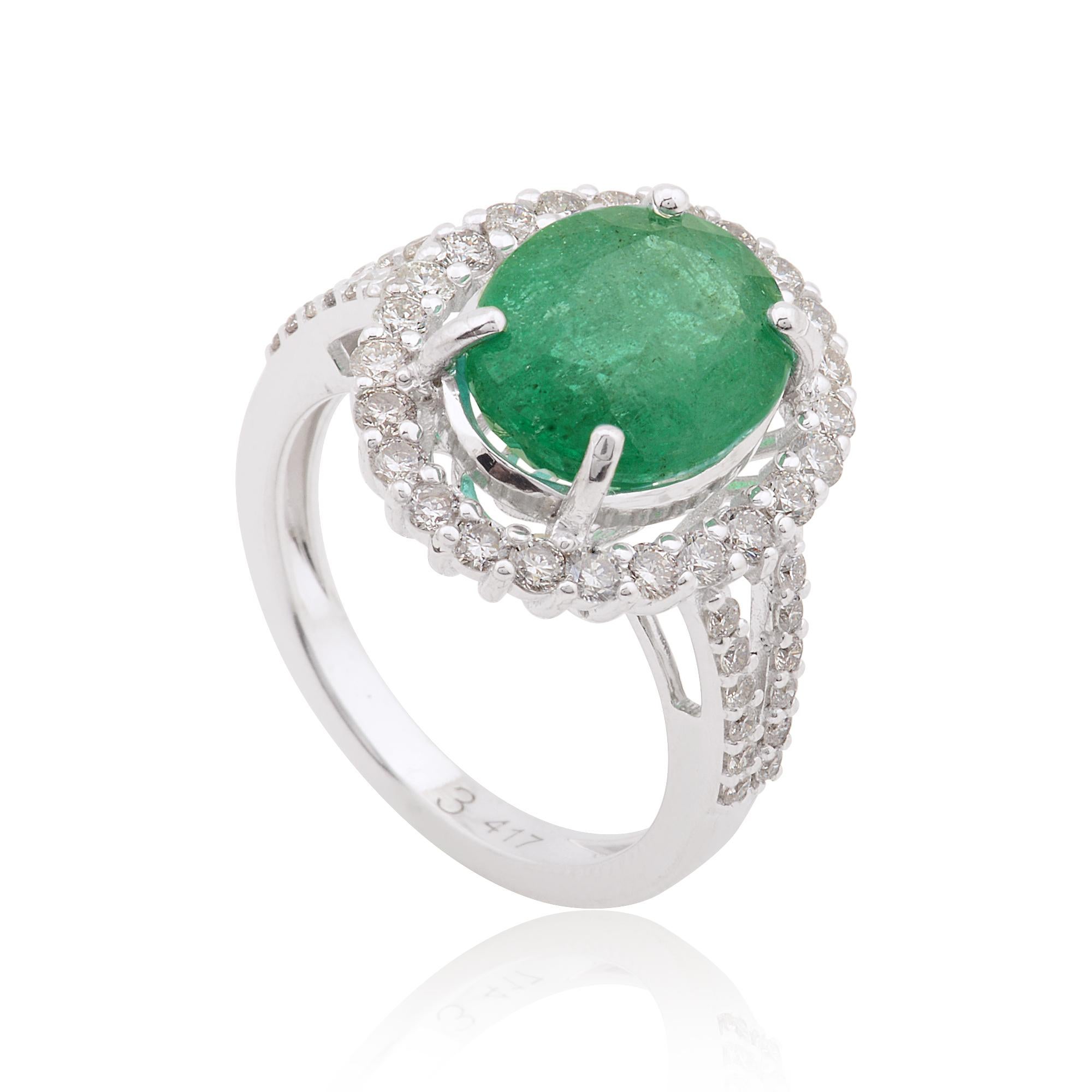 A cocktail ring featuring an oval-shaped emerald gemstone and diamonds in 10 karat white gold is a glamorous and striking piece of fine jewelry. The ring typically showcases a large oval-shaped emerald as the central feature, accented by