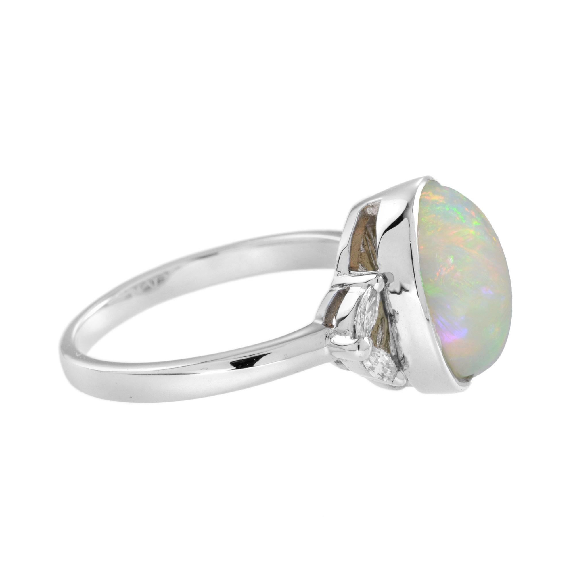 Opal is a gemstone that inspires awe and wonder. This natural opal weight 3.67 carats, and is a perfectly polished cabochon. The ring features small sparkling diamonds on shoulders, adding brilliance to the design. 
Ring Information
Metal: 14K White