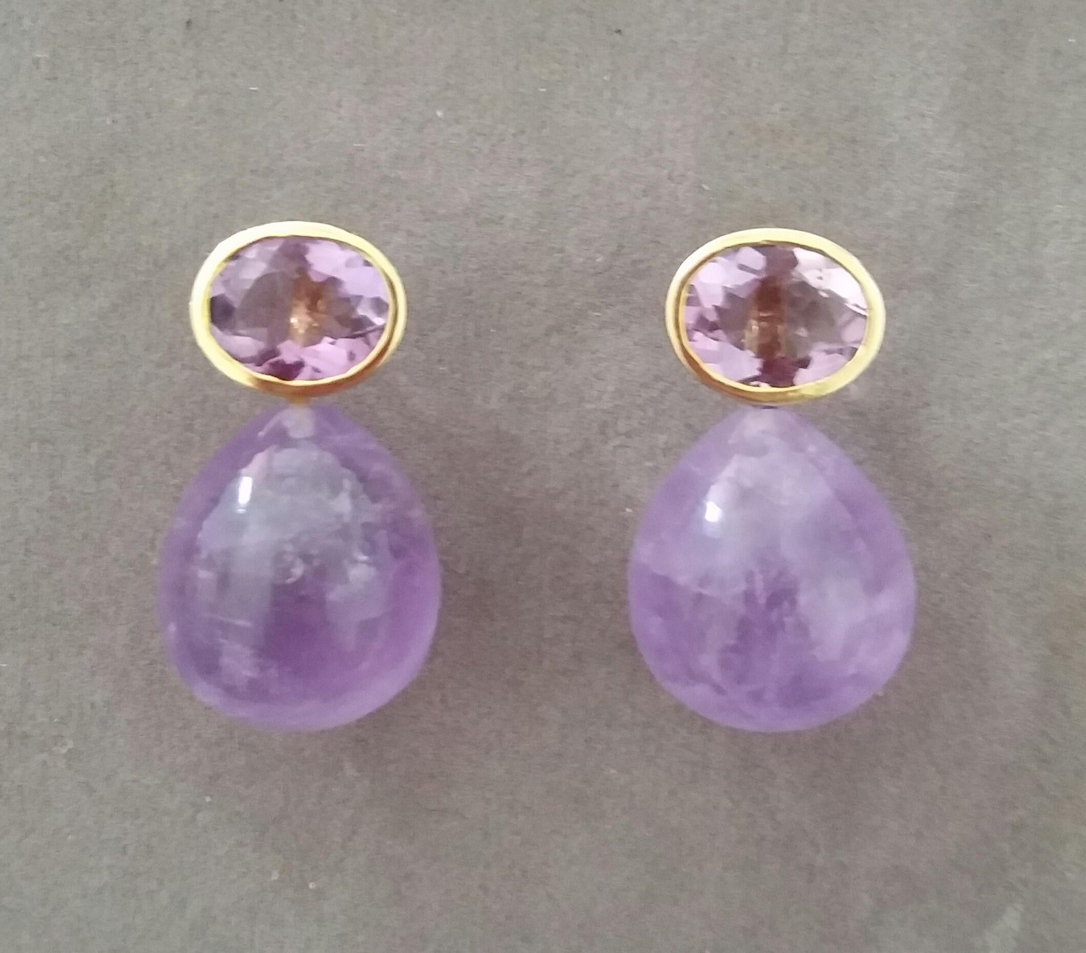 Simple chic stud earrings with a pair of Oval Cut Amethyst measuring 8mm x10 mm set in solid 14 Kt. yellow gold on the top and in the lower parts 2 Round Plain Amethyst Drop measuring 15x16 mm .
In 1978 our workshop started in Italy to make