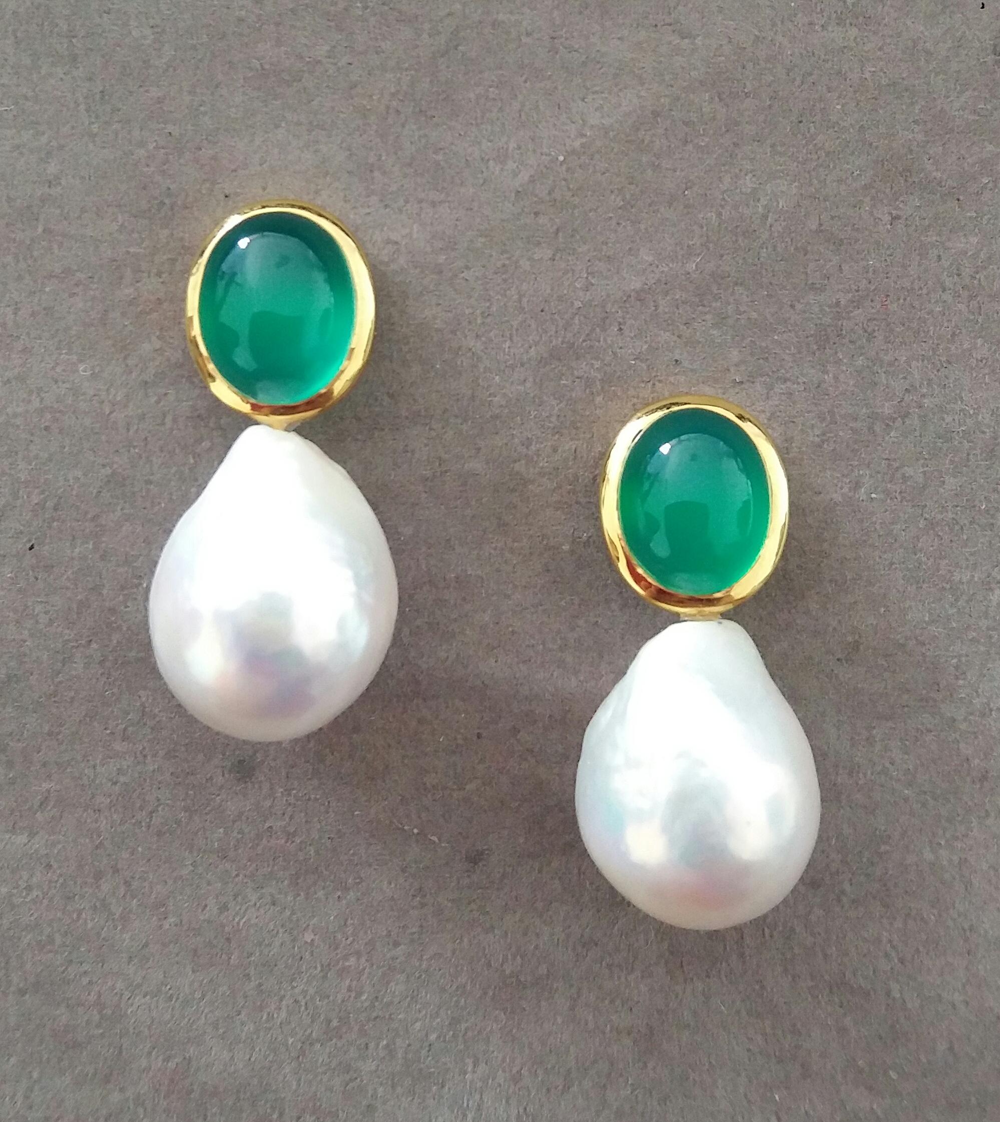 These simple chic and handmade stud earrings have a pair of Oval Shape Natural Green Onyx Cabs measuring 9 x 11 mm set in solid 14 Kt. yellow gold bezel on the top and in the lower parts 2 excellent luster White Pear Shape Baroque Pearls measuring