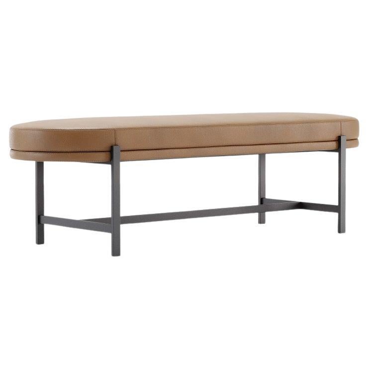 This is a discreet and elegant bench perfect for contemporary settings. With a fully upholstered seat, it features both delicate single and double-top stitching as a touch of luxury. It is also characterized by an intricate metallic t-shape base