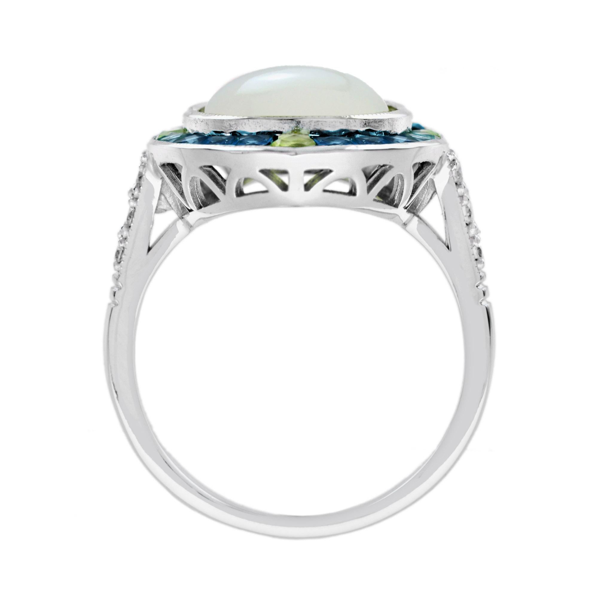 Bague de cocktail de forme ovale en pierre de lune, diamant, topaze bleue et péridot de style Art déco Pour femmes en vente