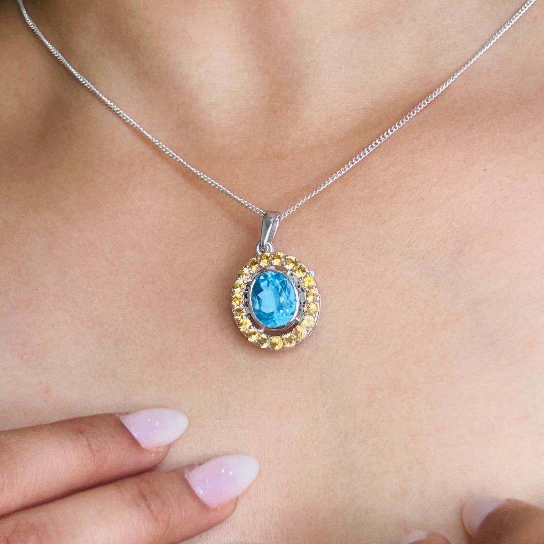 Stunning Oval Shape Multi Gemstone Pendant for Wedding Gift in sterling silver studded with oval, round cut topaz, citrine. This stunning piece of jewelry instantly elevates a casual look or dressy outfit.
Blue Topaz, Citrine Gemstone enhances the