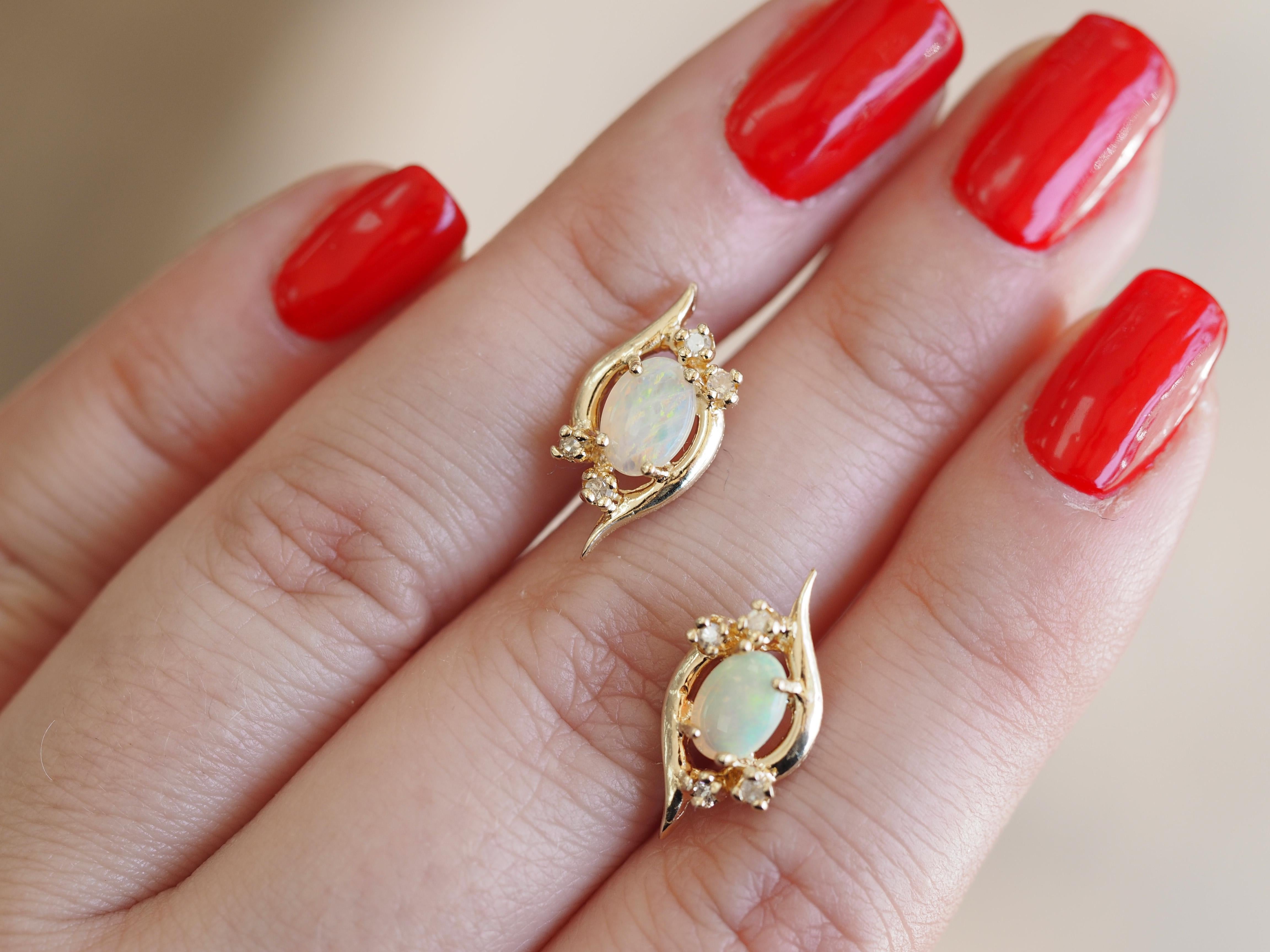 These lovely earrings are a vintage lover's dream. The timeless look of natural white opals surrounded with diamonds and set in yellow gold is such a beautiful vintage style. Each earring features a Oval Shape opal with diamonds. They would be