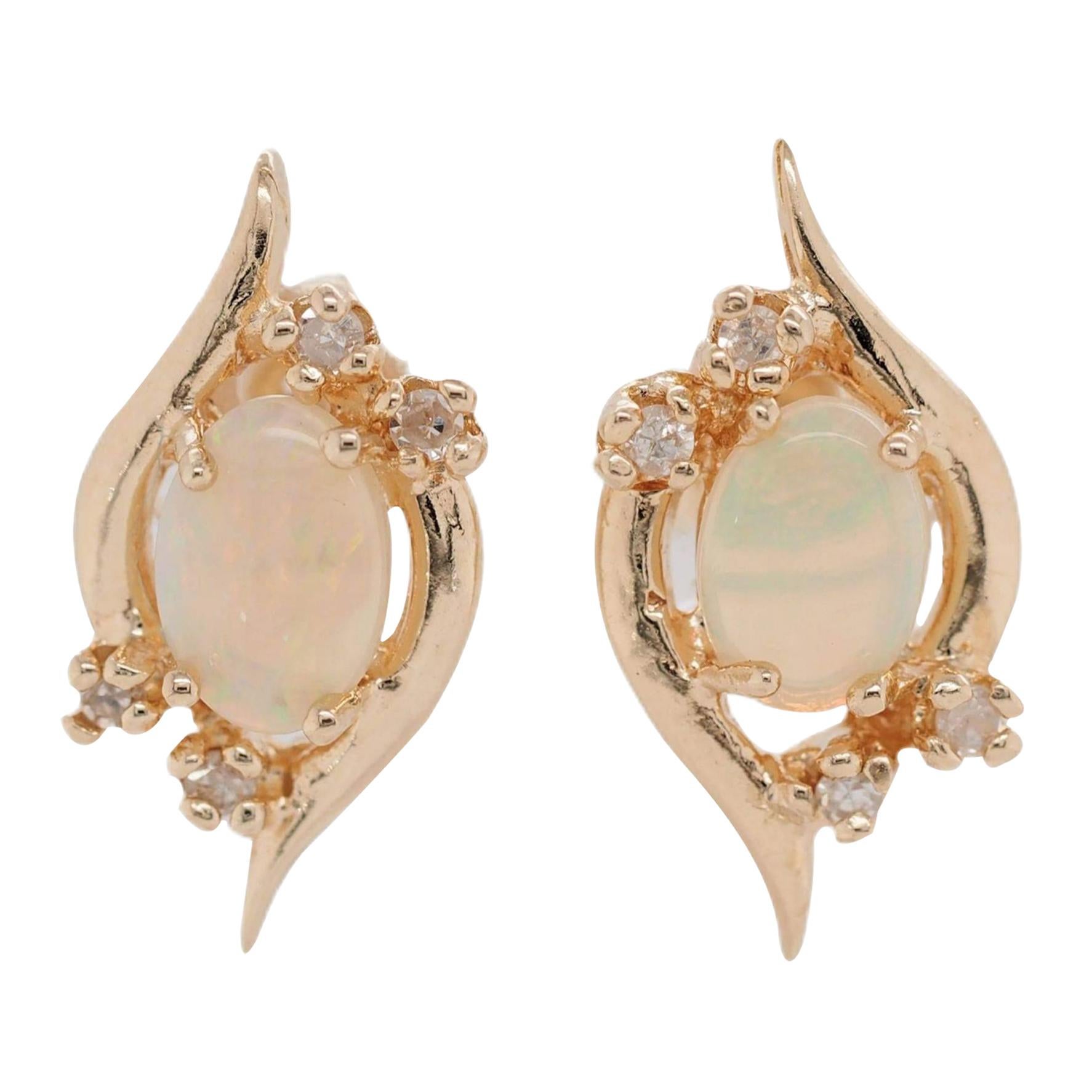Oval Shape Opal and Diamond Stud Earrings of 14 Karat Yellow Gold