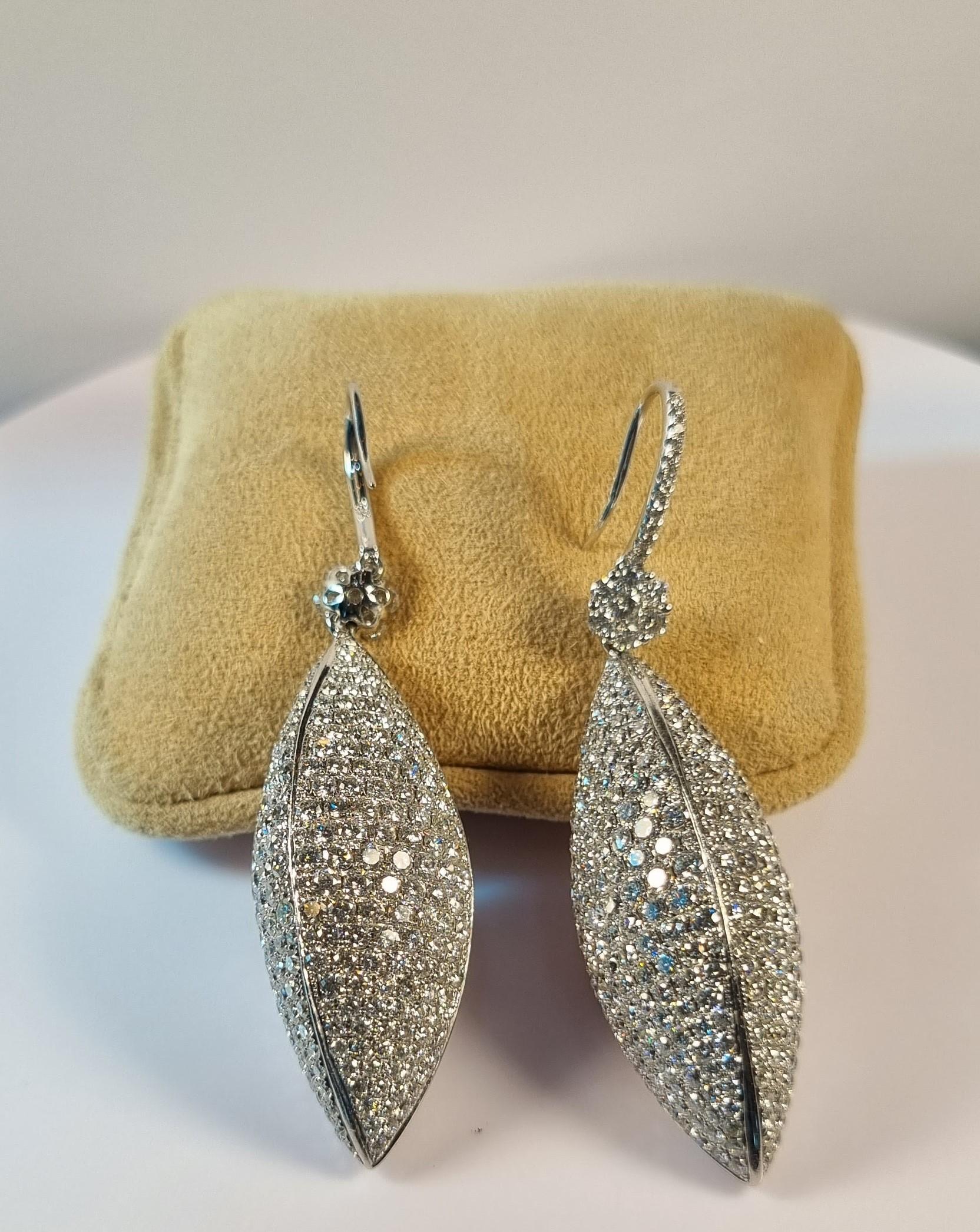 Oval shape Pavé of  diamonds earrings 
918  Diamonds total 15.20ct.
Diamond Quality  G VS
Length 80mm / 3.14in.
Weight 19.34gr total the two
Irama Pradera is a Young designer from Spain that searches always for the best gems and combines classic