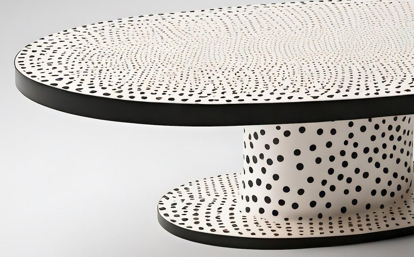Voici notre table basse ovale Polkadot, une pièce saisissante inspirée de l'art emblématique de Yayoi Kusama. Cette table basse blanche, ornée de pois noirs méticuleusement réalisés à la main, est conçue pour se démarquer dans tout salon moderne. Le