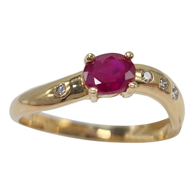 Oval Cut Ruby Three Stone Ring with Diamond Accents in 18 Karat Yellow ...