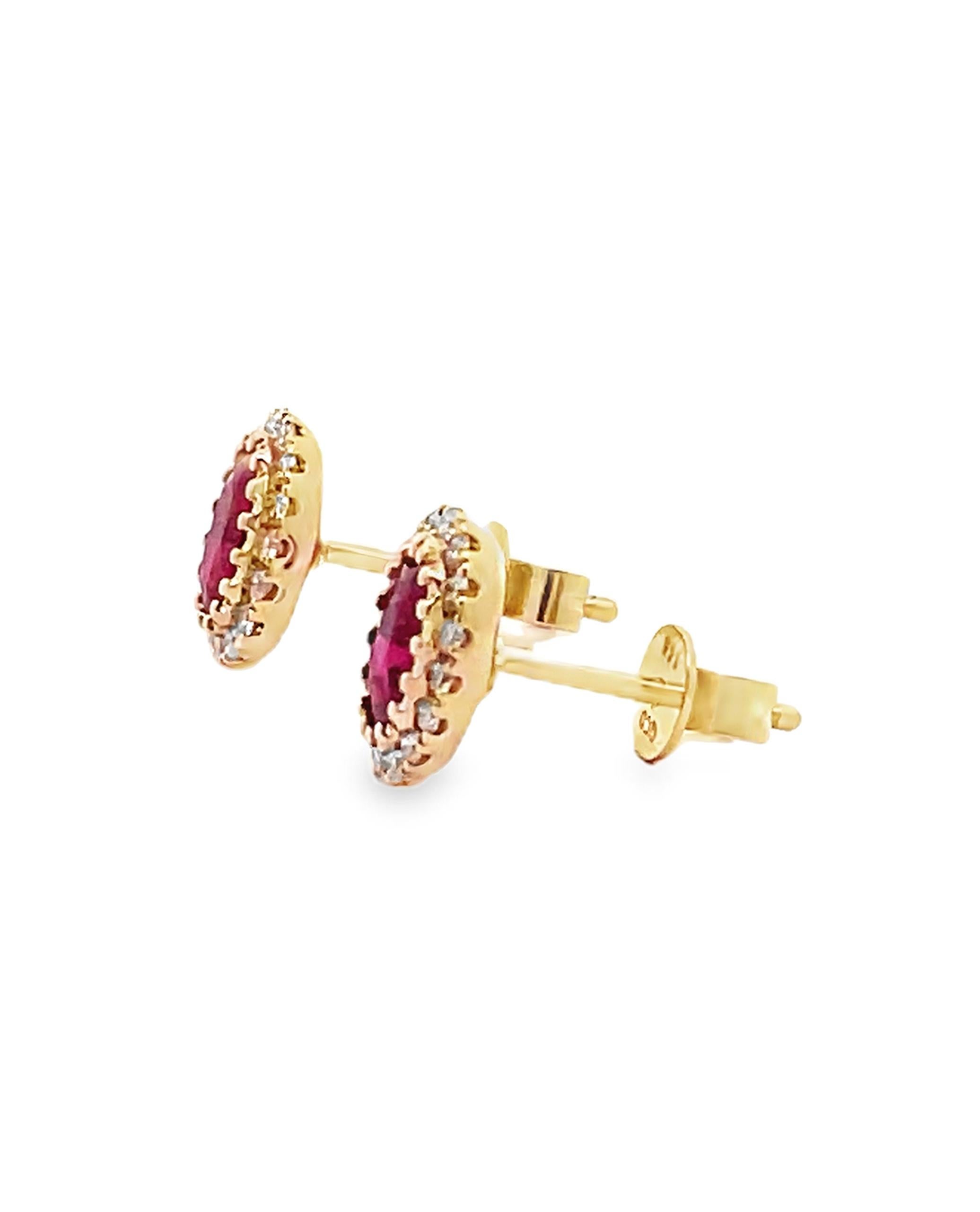 14K yellow gold halo style stud earrings with round faceted diamonds weighing 0.46 carat total and in the center two oval rubies weighing 1.25 carats total. 

- Diamonds are H color, SI clarity