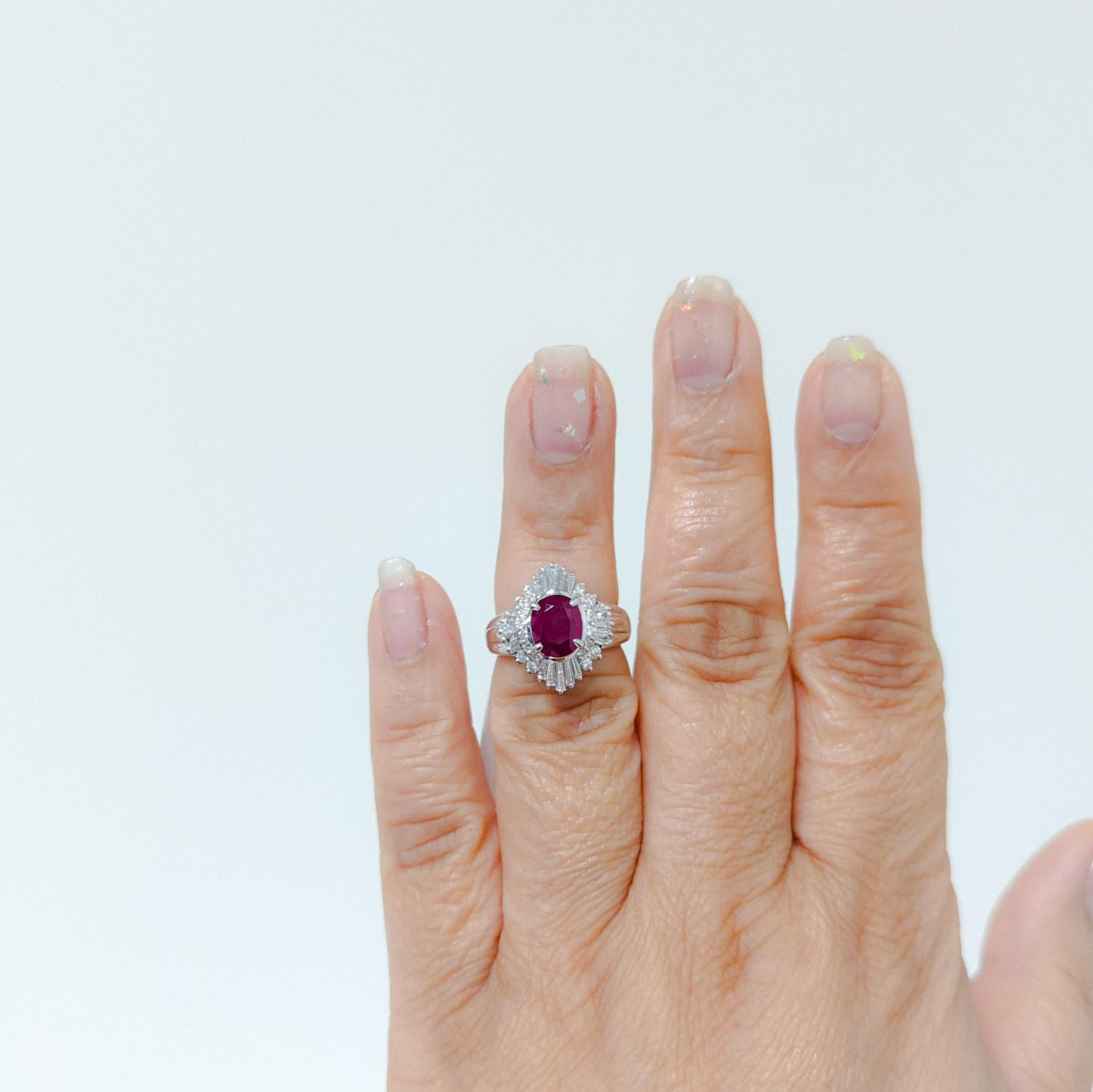 Beautiful 1.98 ct. good quality red ruby oval with 1.01 ct. good quality white diamond baguettes and rounds.  Handmade in platinum.  Ring size 5.75.