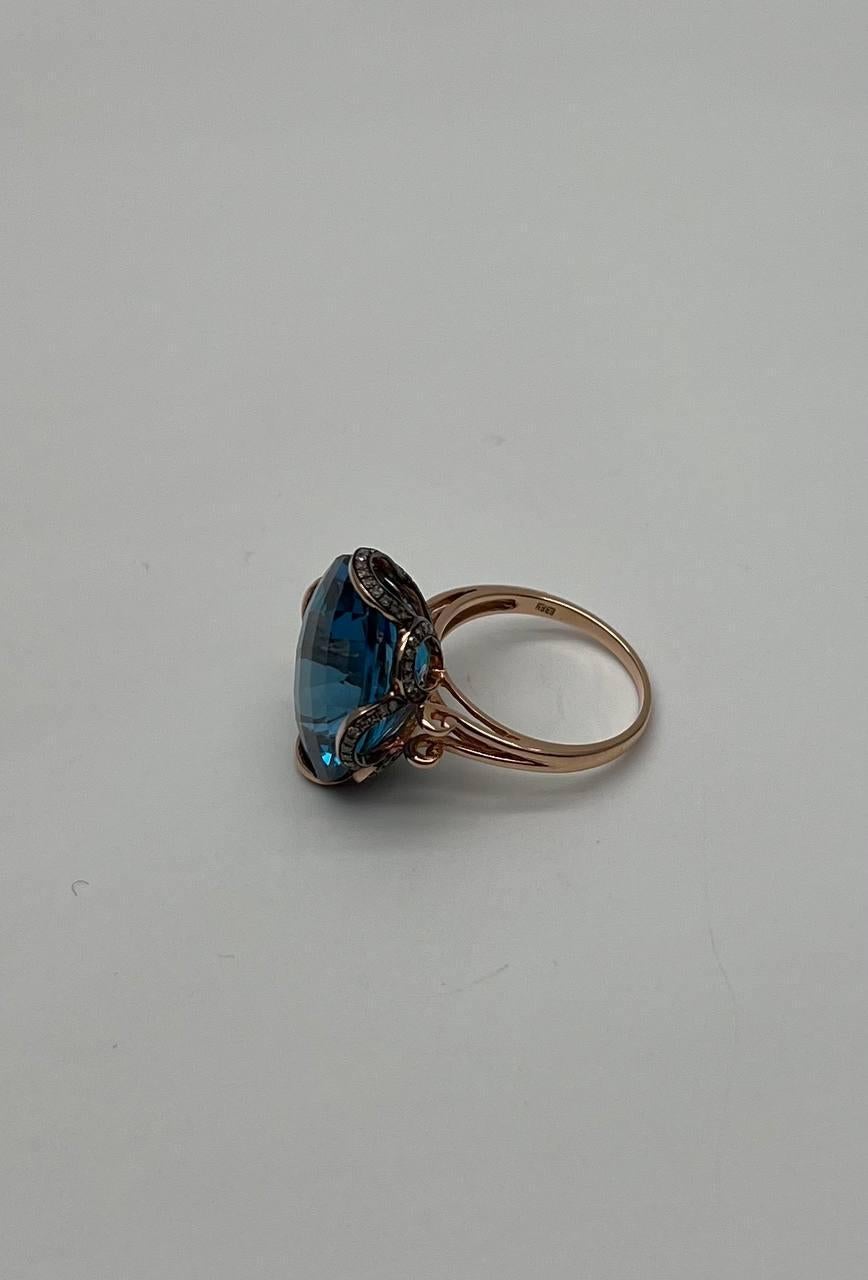 Oval Cut Oval Shape Swiss Blue Topaz 14K Rose Gold Champagne Halo Cocktail Ring For Sale