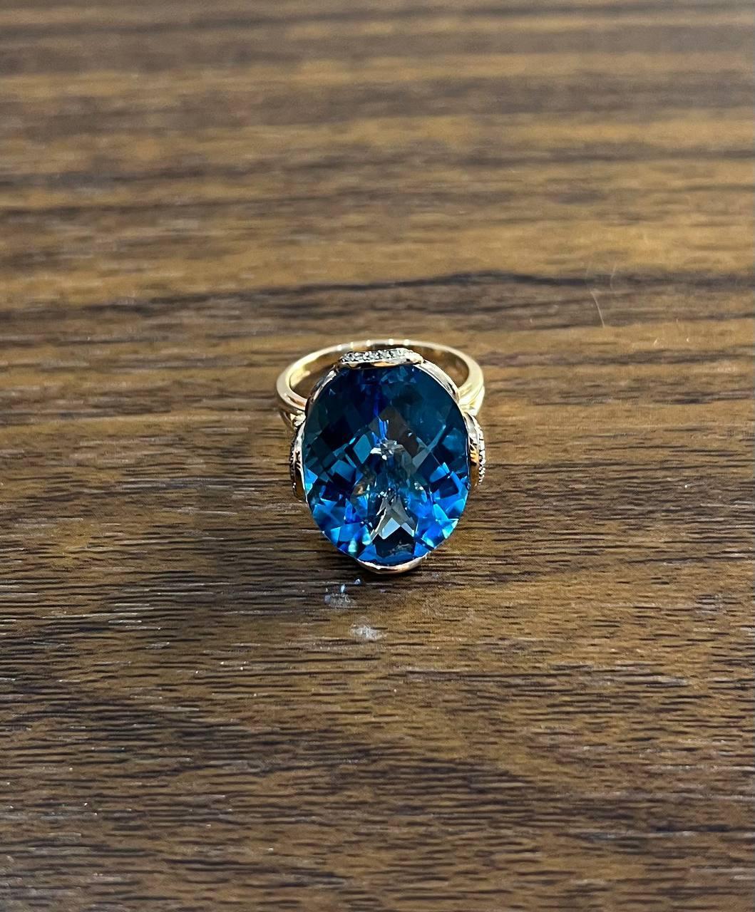 Women's Oval Shape Swiss Blue Topaz 14K Rose Gold Champagne Halo Cocktail Ring For Sale