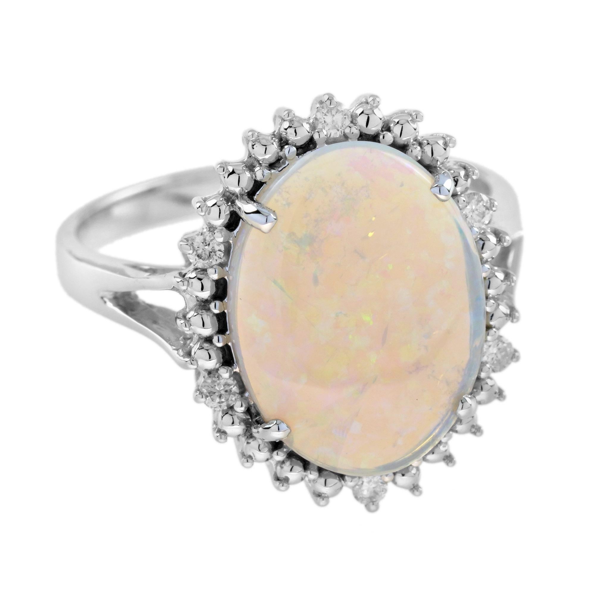 This beautiful ring is a vintage inspired style, the halo ring features play-of-color oval 2.53 carat opal for its center, surrounded by six white diamonds. This would make a wonderful statement ring, or just because it is beautiful. 
Ring