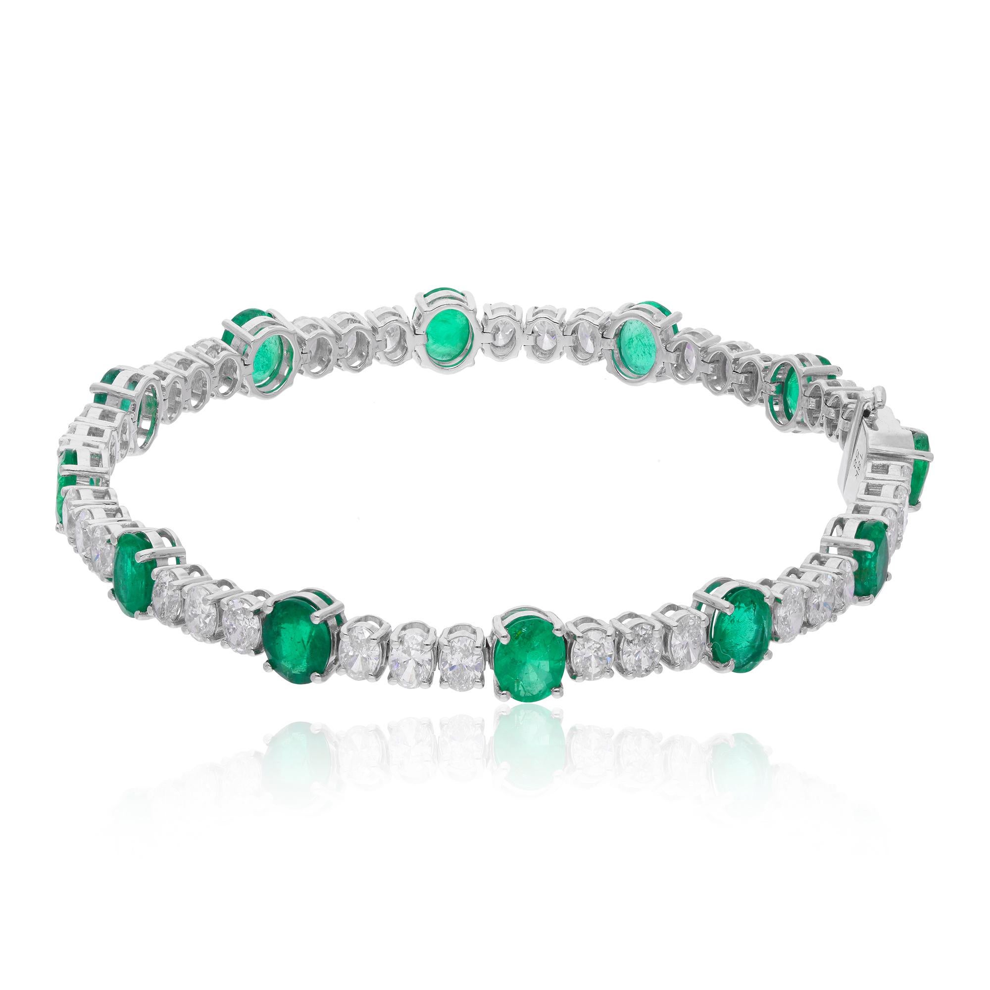 Immerse yourself in the allure of luxury with this exquisite Oval Shape Zambian Emerald Diamond Bracelet, meticulously handcrafted in 18 karat white gold. This stunning piece of jewelry features a captivating array of oval-shaped Zambian emeralds,