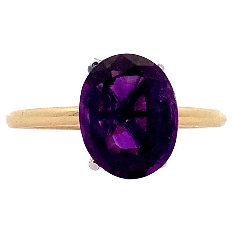 Oval shaped amethyst purple cocktail ring 18k yellow gold