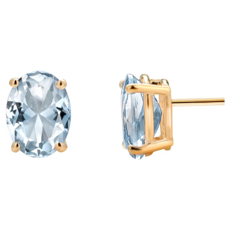 Oval Shaped Aquamarine Set in Yellow Gold Stud Earrings For Sale