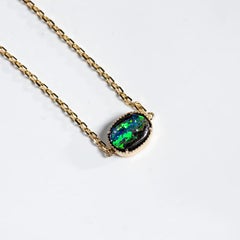 Oval Shaped Australian Boulder Opal Bracelet in 14K Yellow Gold