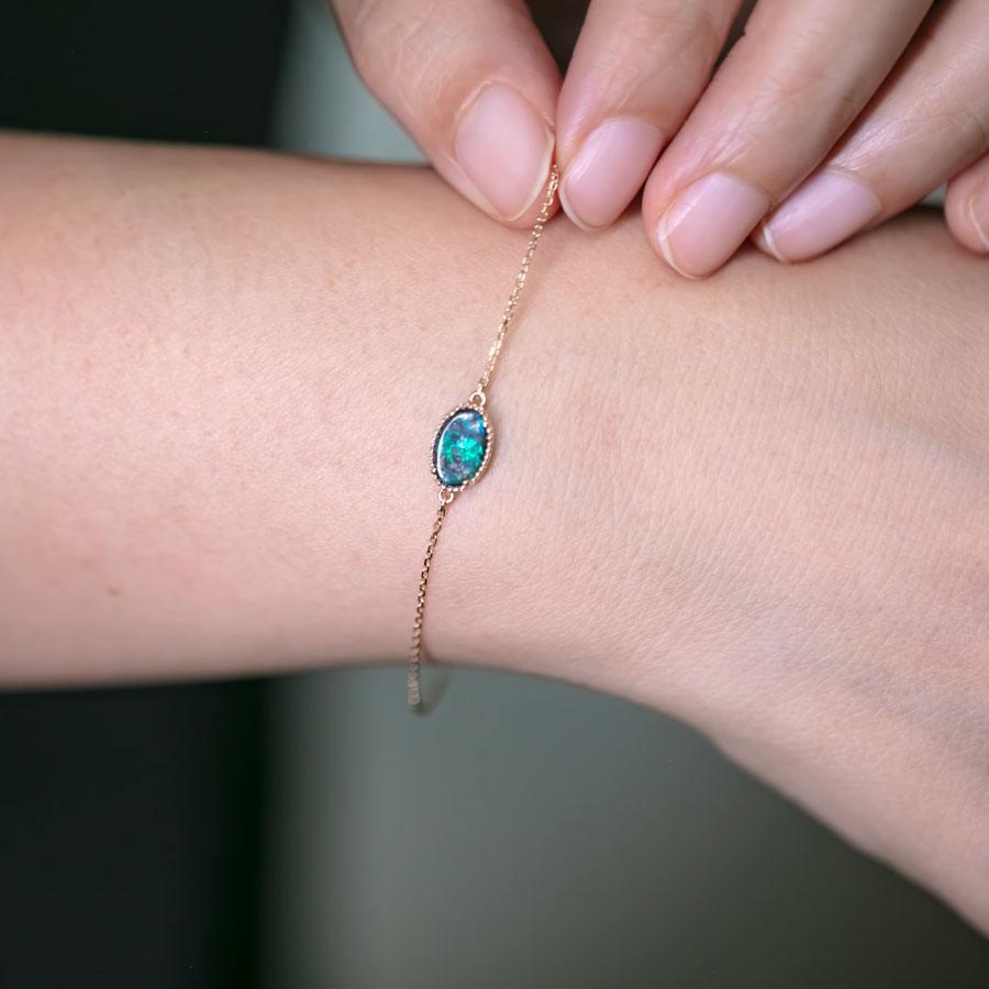 Arts and Crafts Oval Shaped Australian Boulder Opal Bracelet in 18K Yellow Gold For Sale