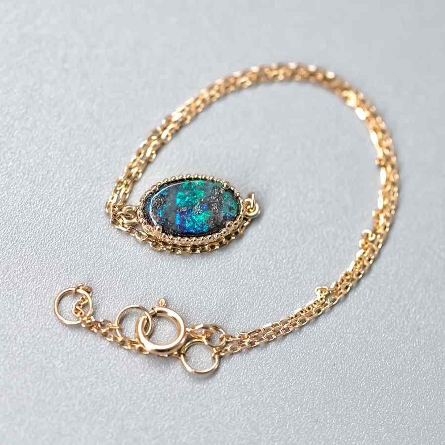 Oval Cut Oval Shaped Australian Boulder Opal Bracelet in 18K Yellow Gold For Sale