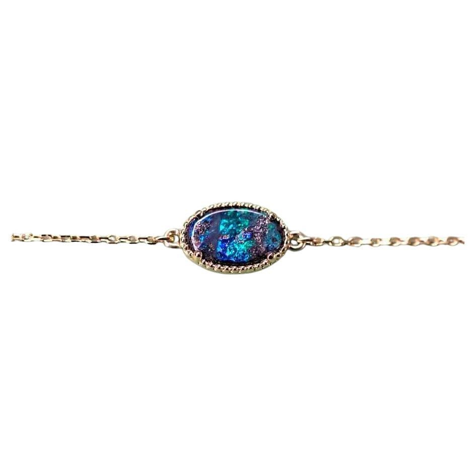 Oval Shaped Australian Boulder Opal Bracelet in 18K Yellow Gold For Sale