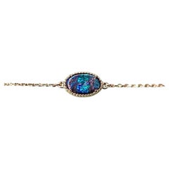 Oval Shaped Australian Boulder Opal Bracelet in 18K Yellow Gold
