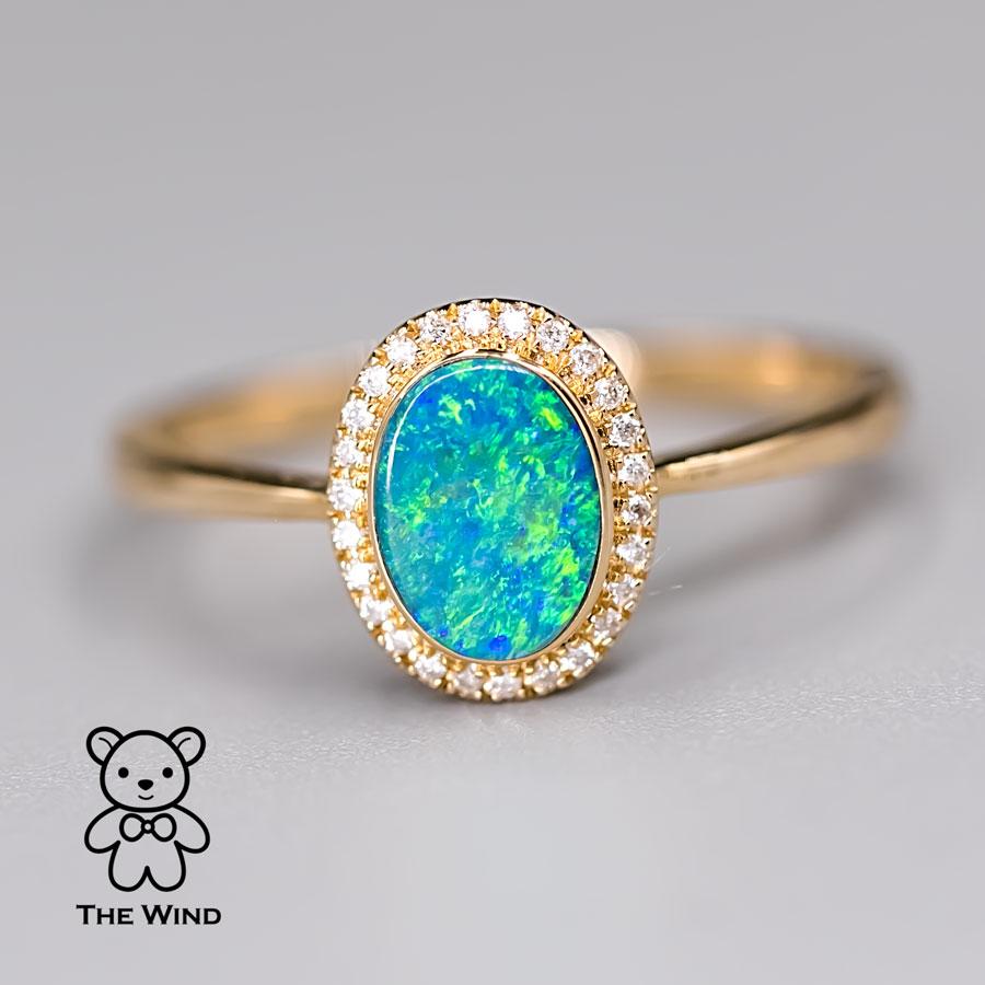 Arts and Crafts Oval Shaped Australian Doublet Opal Halo Diamond Ring 14k Yellow Gold For Sale