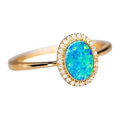 Ovaler australischer Doublet Opal Halo Diamantring 14k Gelbgold in Ovalform