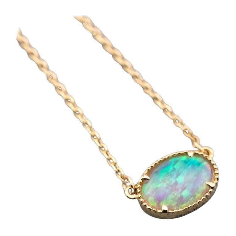 Collana con opale massiccio australiano di forma ovale, in oro giallo 14K