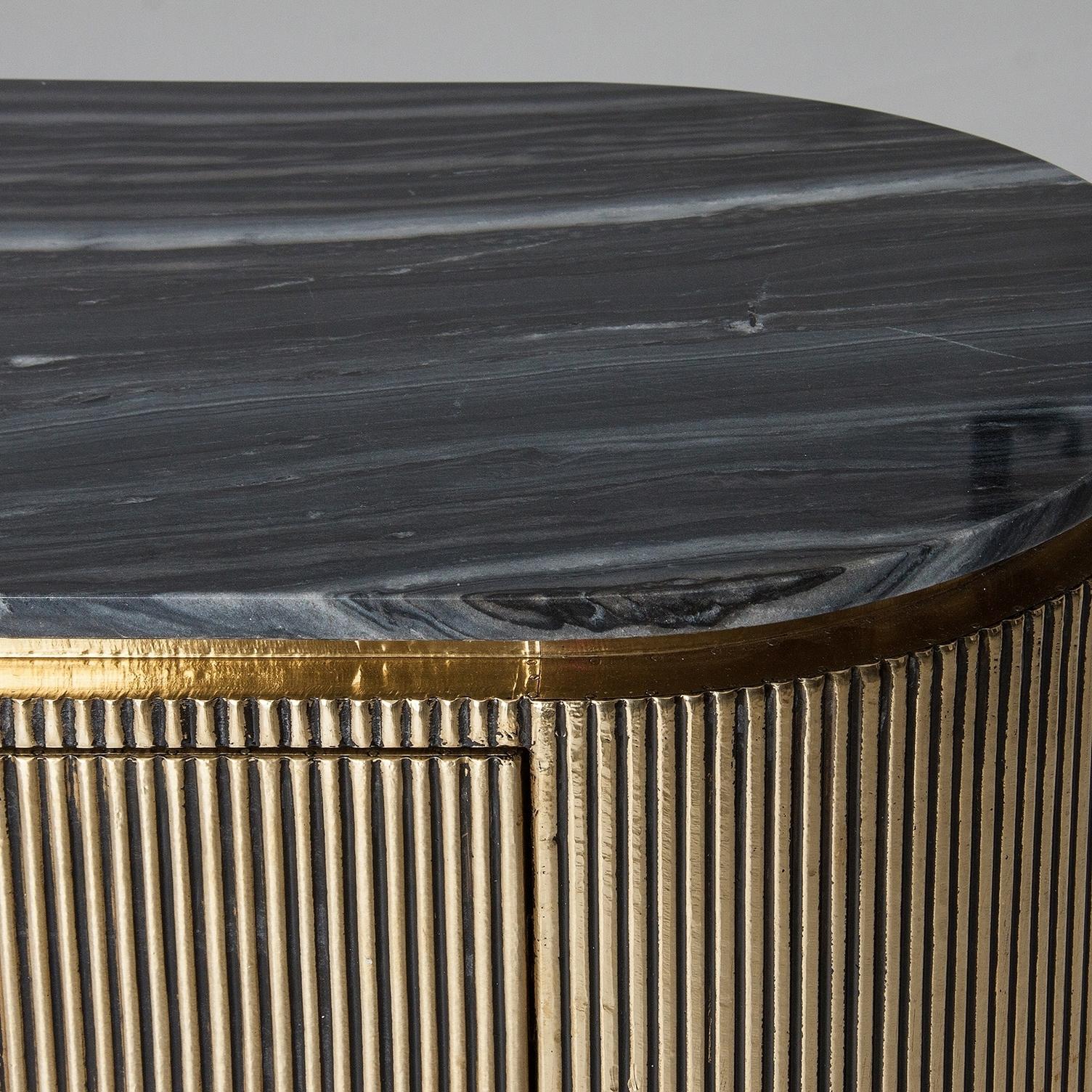 Oval black marble tray, curved and rounded lines for this sparkling and sophisticated cabinet with gilt metal finishes, opening shelves spaces and drawers. Amazing!