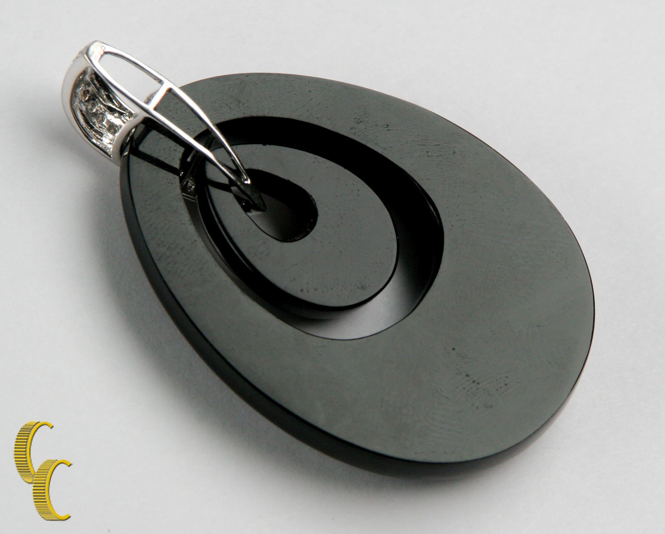 Round Cut Oval Shaped Black Onyx and Diamond Pendant Set in 18 Karat White Gold For Sale