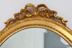 Oval shaped carved gilded Baroque mirror with beveled glass, Belgium