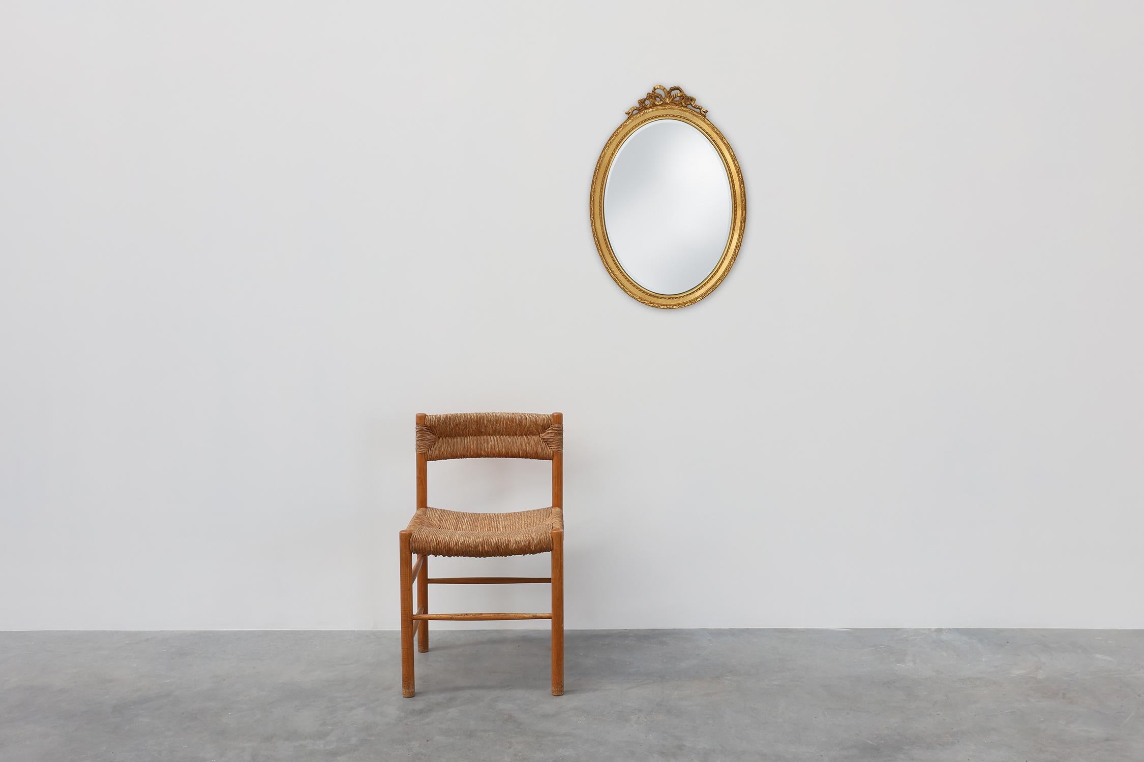 Beveled Oval shaped carved gilded Baroque mirror with beveled glass, Belgium For Sale