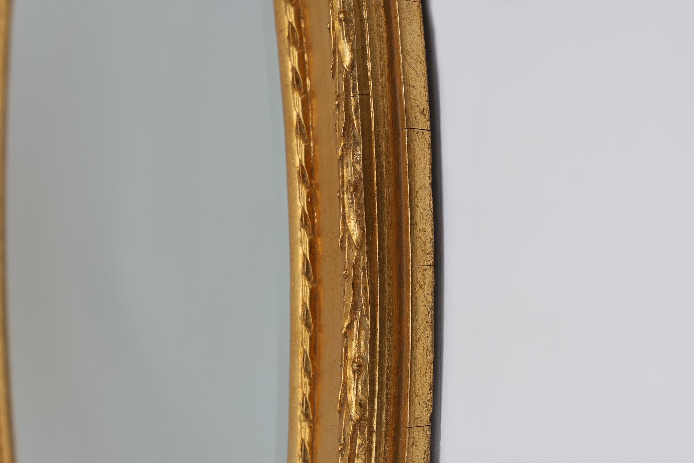Mirror Oval shaped carved gilded Baroque mirror with beveled glass, Belgium For Sale