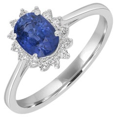 Bague en or blanc 18k avec saphir bleu de Ceylan de forme ovale et diamants