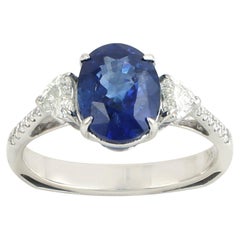 Oval Shaped Ceylon Blue Sapphire Ring Accented With Diamonds Made In 18k Gold