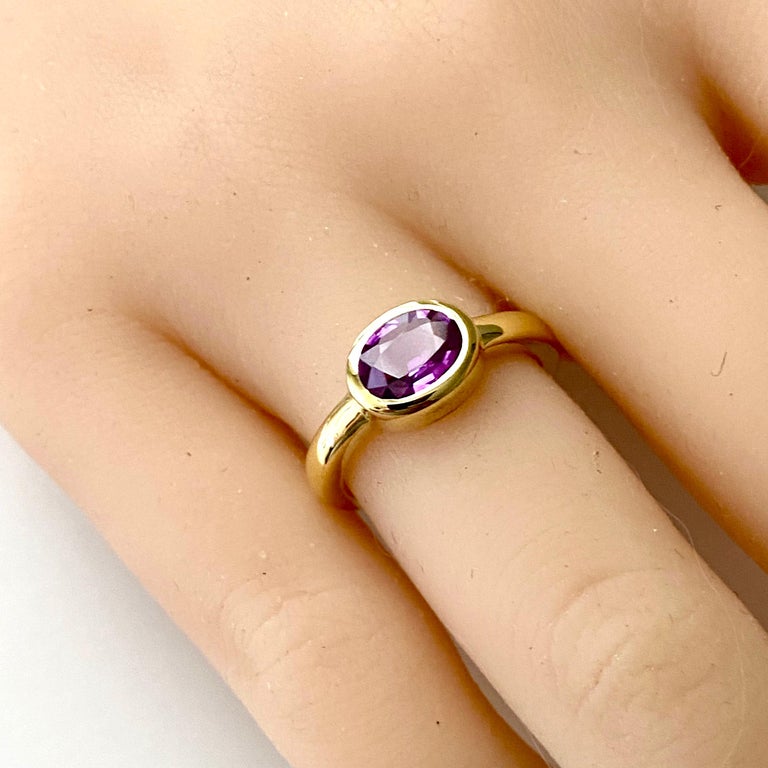 Modern Oval Shaped Ceylon Pink Sapphire Bezel Raised Dome Yellow Gold Cocktail Ring For Sale