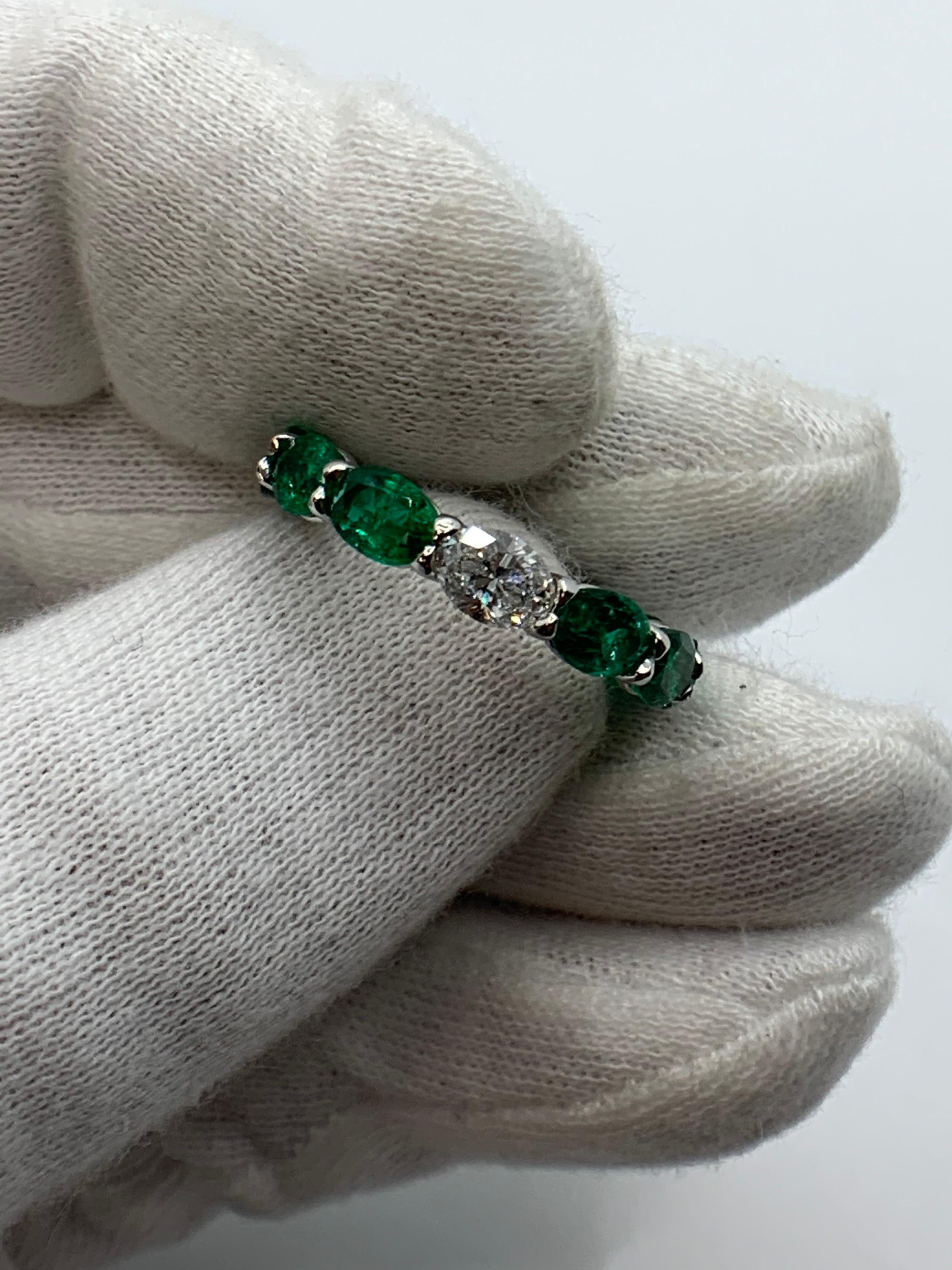 This beautiful Ring features 11 Fine Oval Shaped Emeralds weighing 5.30 Carats with 1 Oval Diamond weighing 0.51 Carat that can be worn Diamond side up or down. Set in Platinum.
Finger Size 6.5.
Can be resized.
Also available in other Gemstones.